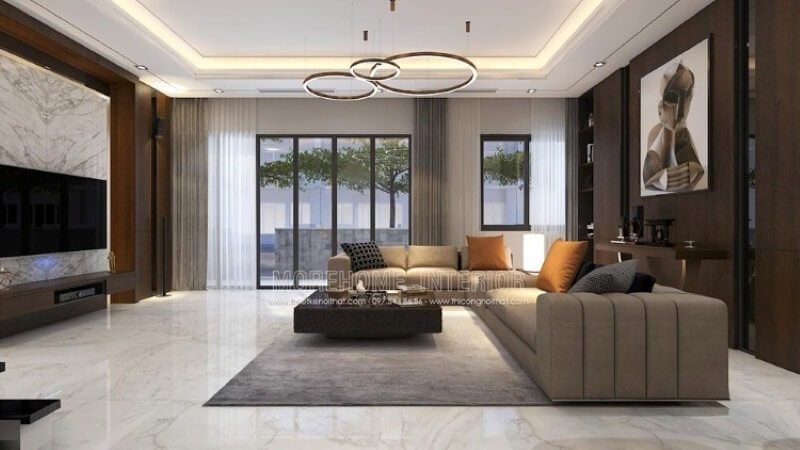 Không gian rộng lớn cần được trang trí để tạo ra cảm giác gần gũi. Morehome đề xuất ý tưởng trong trang trí nội thất biệt thự Park city. Phòng khách được trang trí bằng tone màu trầm và các phụ kiện như tấm gỗ ốp tường, tranh canvas, sofa góc, đá đối vân.